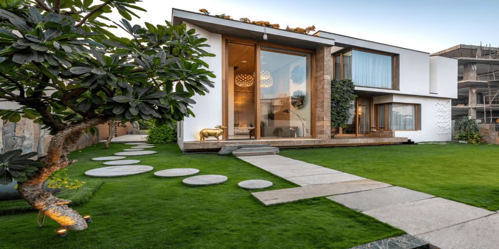 Modern architecture home exterior with minimalist design, large glass windows, clean lines, and sustainable materials in a contemporary residential setting.